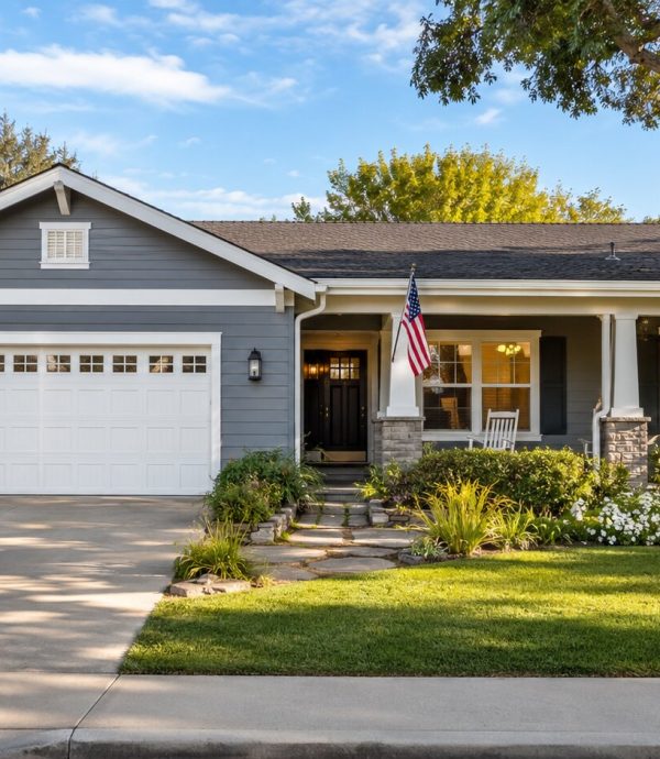Welcoming single-family home with an American flag near the front porch